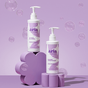 Aria haircare bright and blonde duo on purple background with bubbles