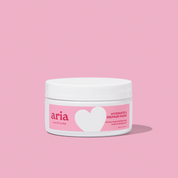 Aria Haircare hydrate and repair mask on pink background